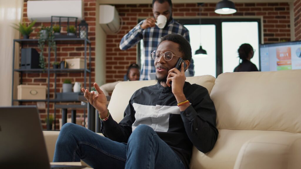African american person chatting on phone call in business office